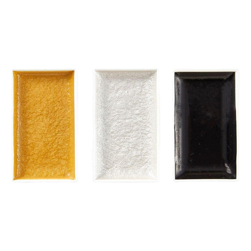 A water color mixing set with three watercolor paints in gold, silver, and indigo colors, displayed alongside a watercolor brush and a card with playing card symbols.